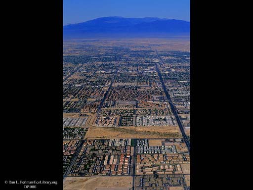 Urbanization to mountains (aerial), Western USA